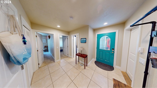 foyer featuring light tile patterned flooring