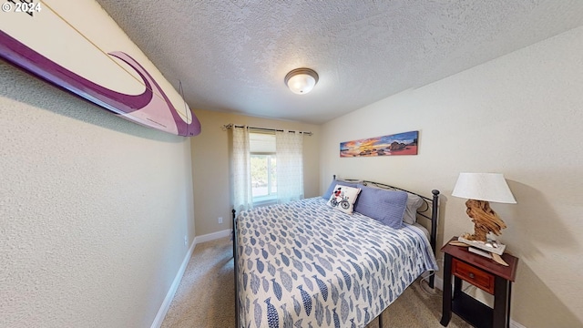 carpeted bedroom featuring a textured ceiling