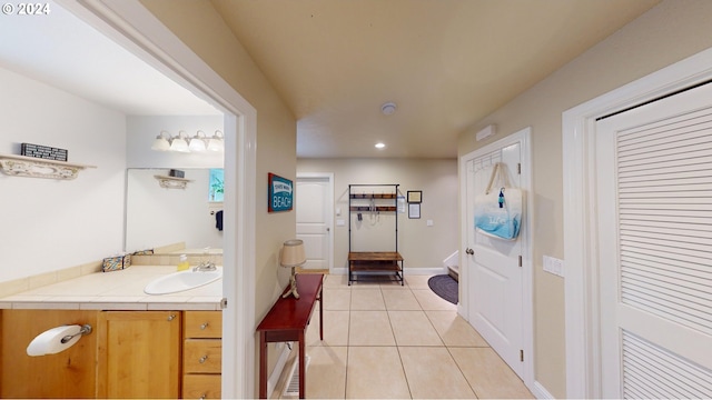 bathroom with tile patterned flooring and vanity