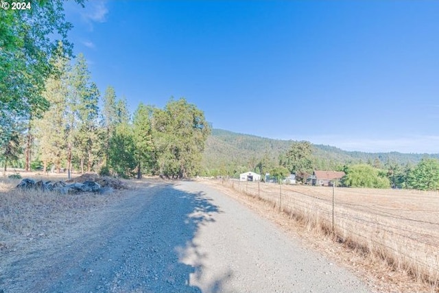 view of street featuring a mountain view and a rural view