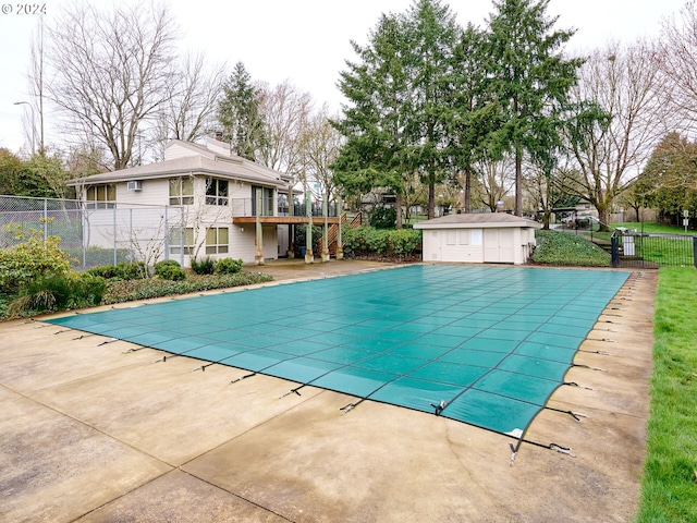 view of pool with an outdoor structure and a patio