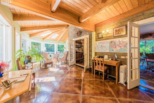 office featuring radiator heating unit, wood ceiling, a wealth of natural light, and lofted ceiling with skylight