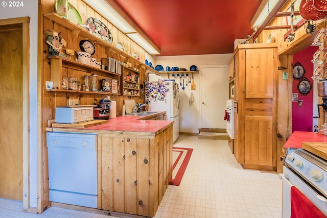 kitchen featuring sink and white appliances