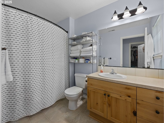 full bath featuring visible vents, tile patterned flooring, toilet, vanity, and curtained shower