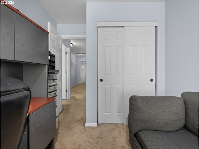 home office featuring light colored carpet