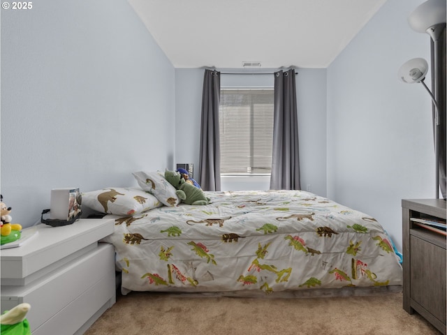 carpeted bedroom featuring visible vents and lofted ceiling