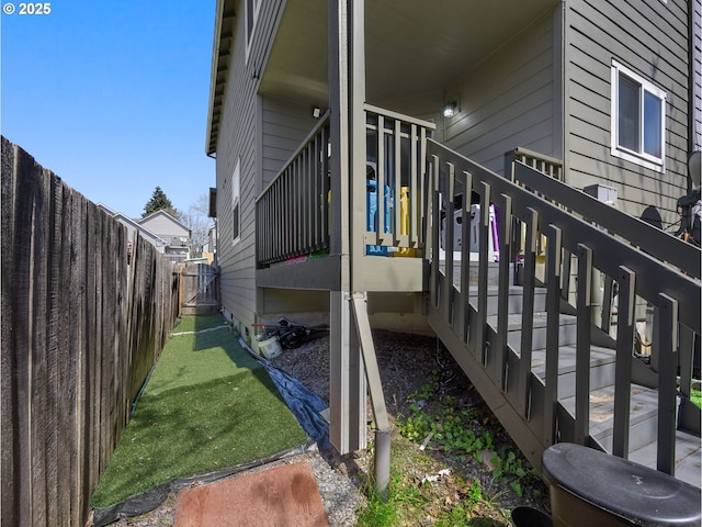 view of side of home featuring a fenced backyard