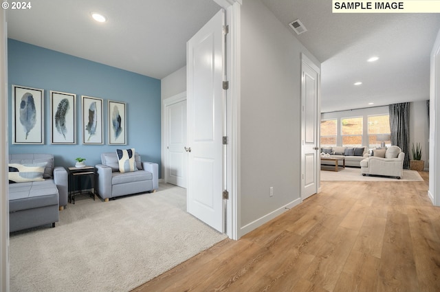 living area with light hardwood / wood-style floors