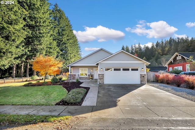 view of front of house featuring a front yard and a garage