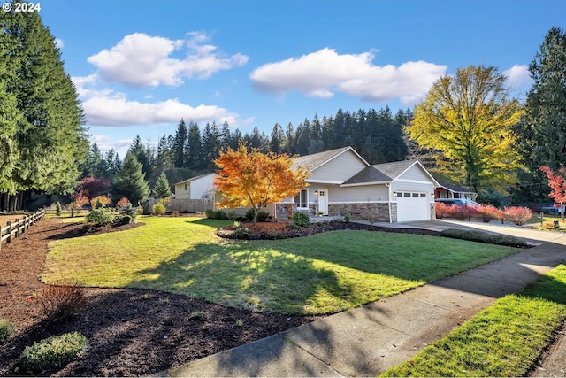 view of front of home featuring a front lawn and a garage