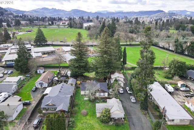 birds eye view of property featuring a mountain view