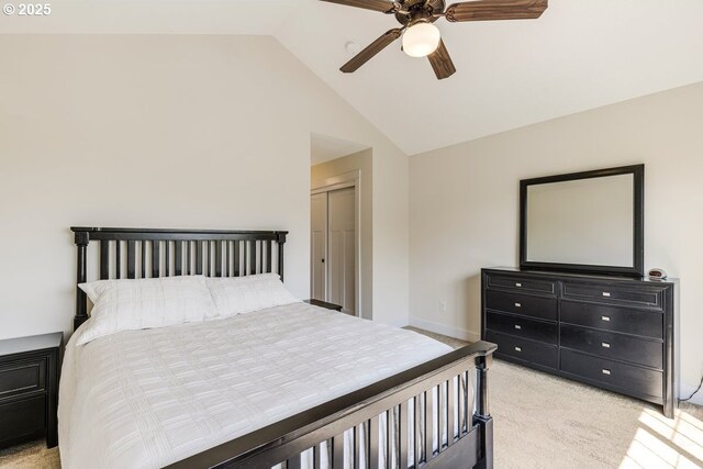 bedroom with a ceiling fan, light colored carpet, vaulted ceiling, and baseboards