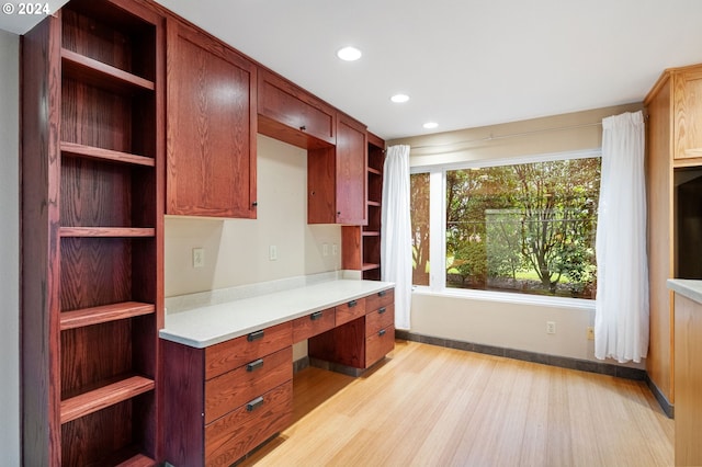 unfurnished office featuring light hardwood / wood-style floors