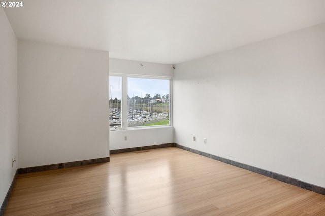 empty room with light hardwood / wood-style floors