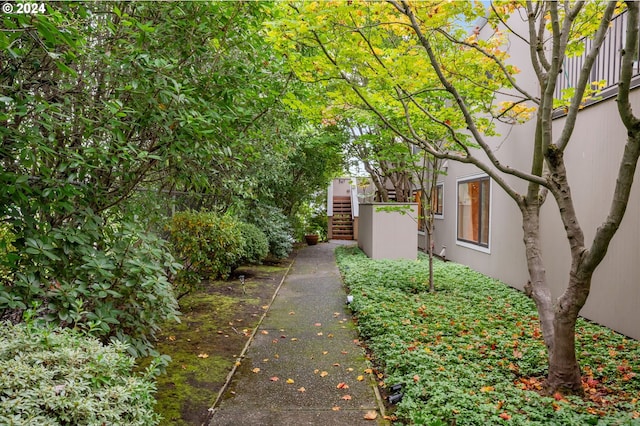 549 N Tomahawk Island Dr # 1, Portland, OR 97217 - view of side of property with stucco siding and stairway