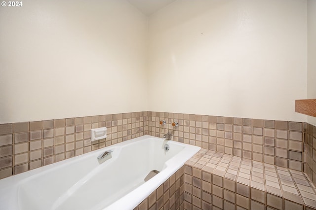 bathroom with tiled bath