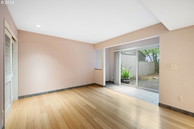 spare room with light hardwood / wood-style flooring