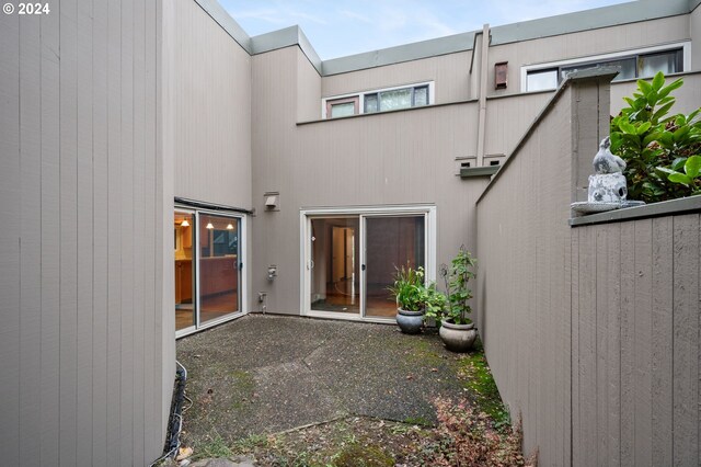 549 N Tomahawk Island Dr # 1, Portland, OR 97217 - back of house featuring a patio