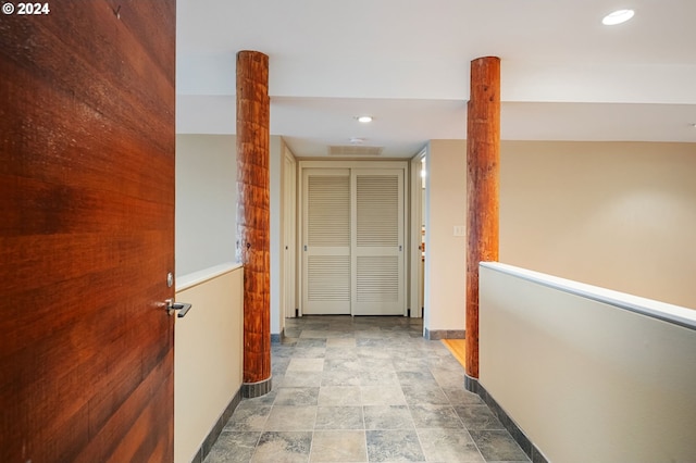 549 N Tomahawk Island Dr # 1, Portland, OR 97217 - hall featuring baseboards, stone finish floor, and recessed lighting