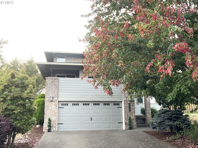 view of front of house featuring a balcony and a garage