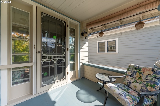 sunroom featuring wooden ceiling