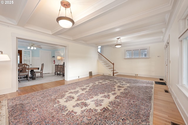 509 High St, Oregon City, OR 97045 - living room featuring light wood-style floors, ornamental molding, stairway, beamed ceiling, and plenty of natural light