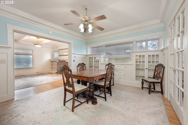 509 High St, Oregon City, OR 97045 - dining space featuring wood finished floors, crown molding, a fireplace, and ceiling fan