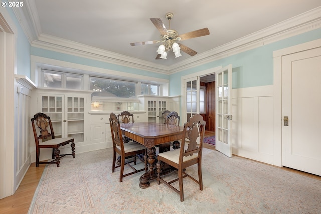 509 High St, Oregon City, OR 97045 - dining space with ornamental molding, light wood finished floors, a decorative wall, french doors, and a ceiling fan