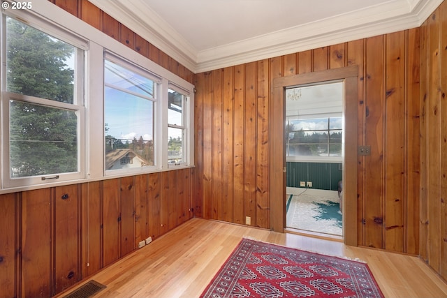 509 High St, Oregon City, OR 97045 - doorway with crown molding, wood finished floors, plenty of natural light, and wooden walls