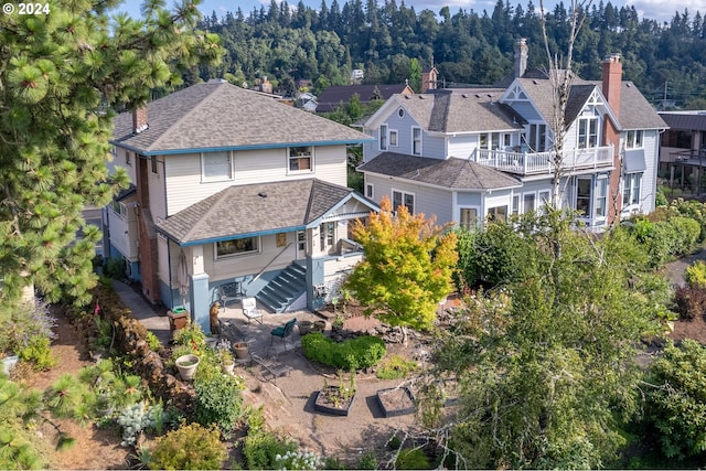 birds eye view of property with a residential view