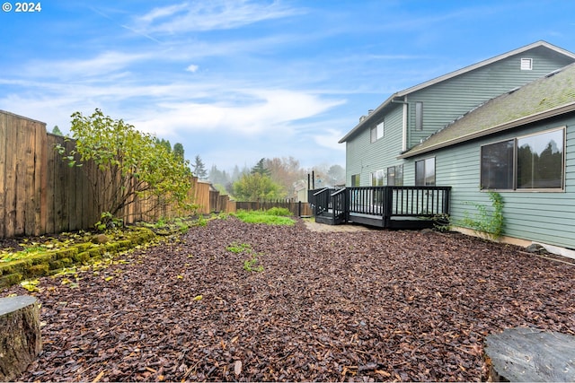 view of yard featuring a wooden deck