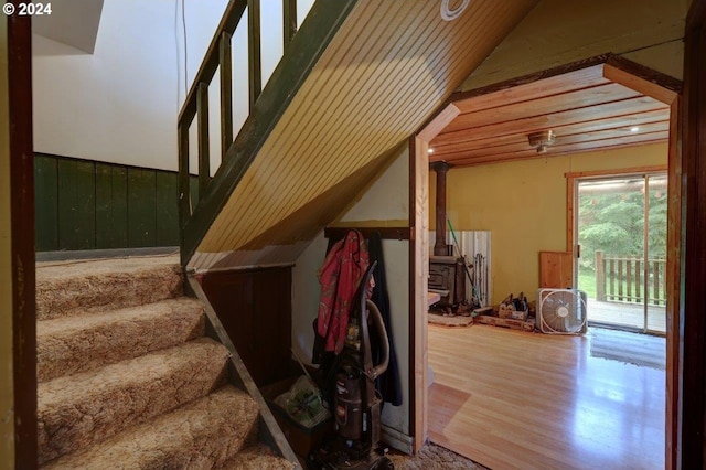 stairs featuring hardwood / wood-style floors