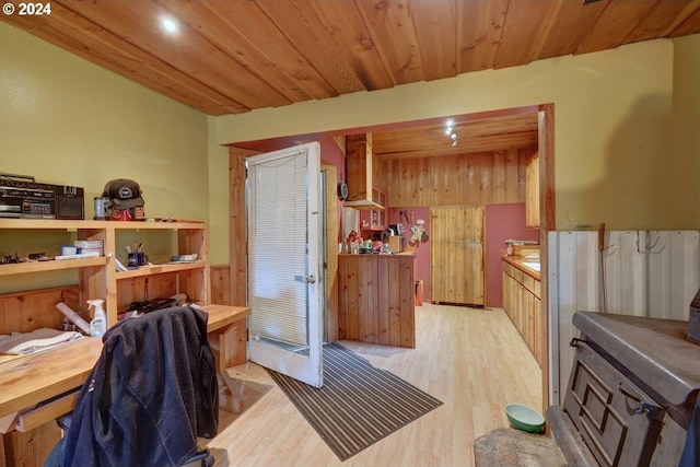 interior space featuring wood ceiling and light hardwood / wood-style flooring