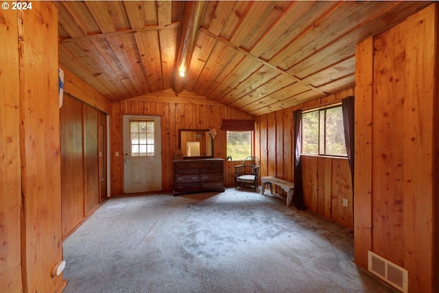 miscellaneous room with lofted ceiling, wooden walls, light carpet, and wooden ceiling