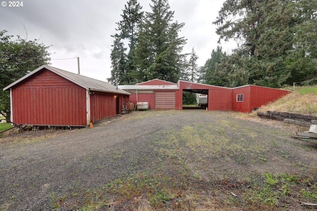 exterior space featuring an outbuilding