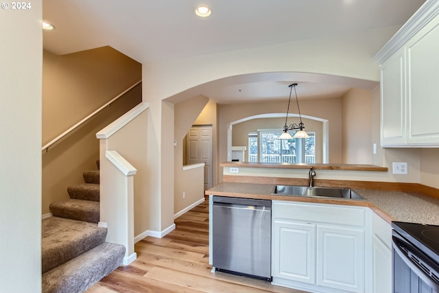 kitchen with sink, pendant lighting, white cabinetry, and stainless steel dishwasher