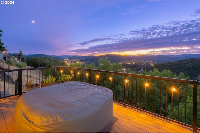 deck at dusk with a mountain view