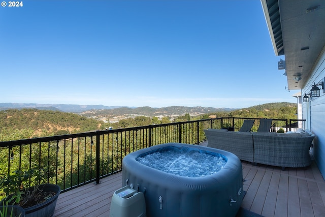 wooden deck featuring a mountain view