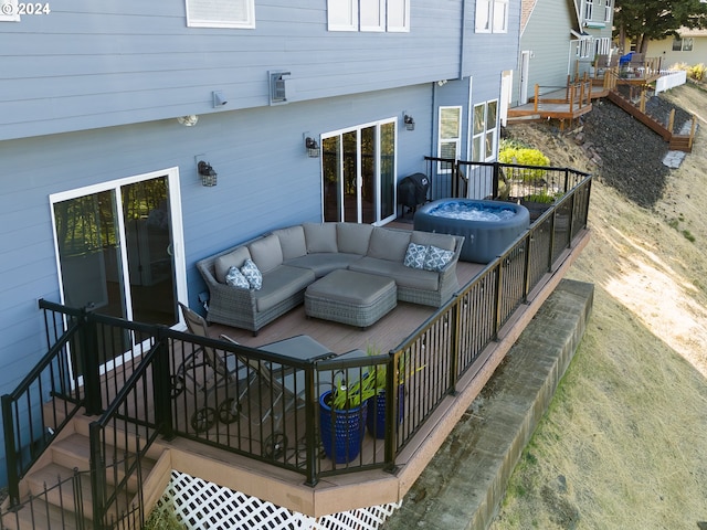 exterior space featuring a jacuzzi and an outdoor living space