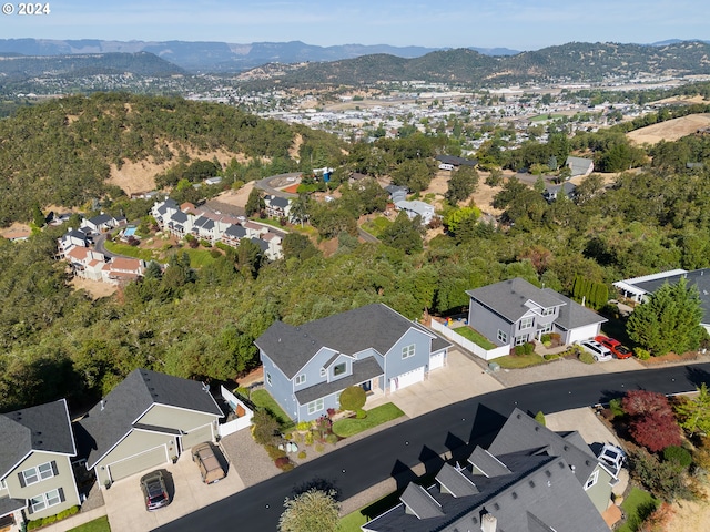 birds eye view of property with a residential view and a mountain view