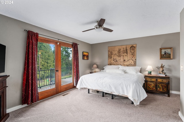 bedroom with access to exterior, carpet, french doors, and ceiling fan