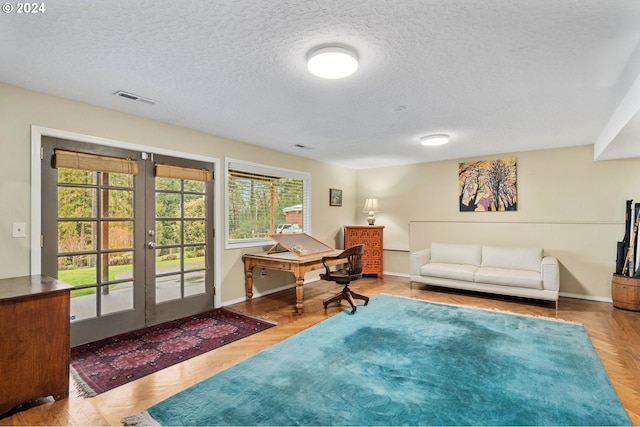 interior space featuring french doors and a textured ceiling