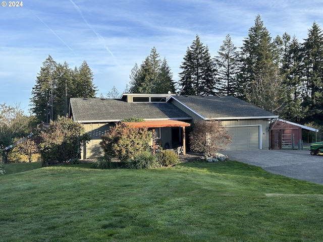 ranch-style home with a front yard and a garage