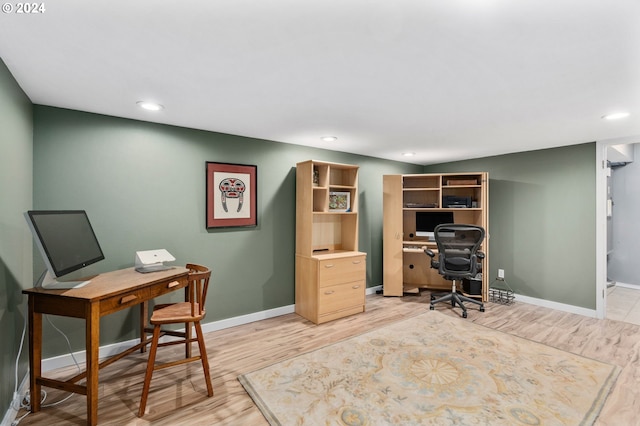 office with light hardwood / wood-style floors