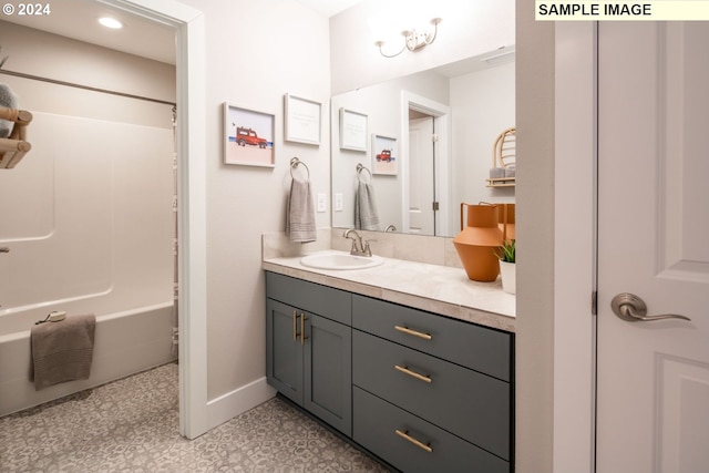 bathroom featuring vanity, bathtub / shower combination, and tile patterned floors