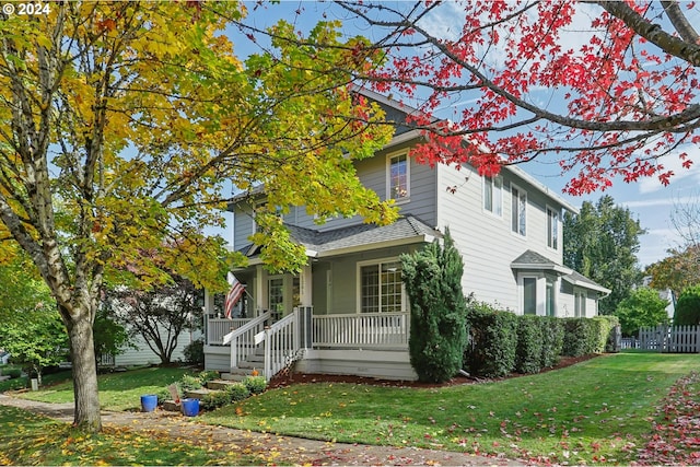 view of front of home featuring a porch and a front lawn