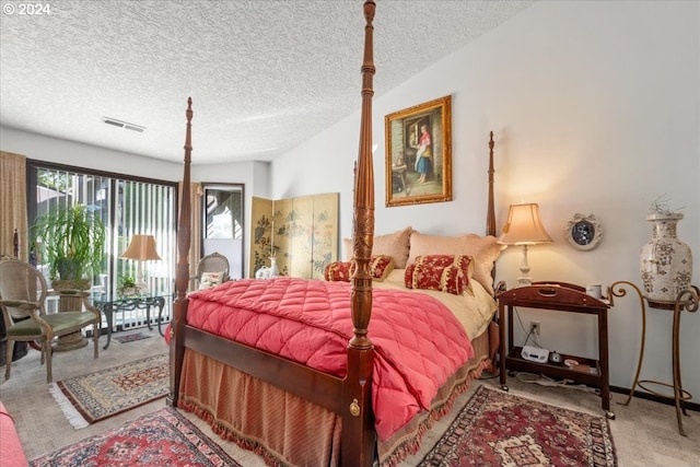 carpeted bedroom featuring a textured ceiling