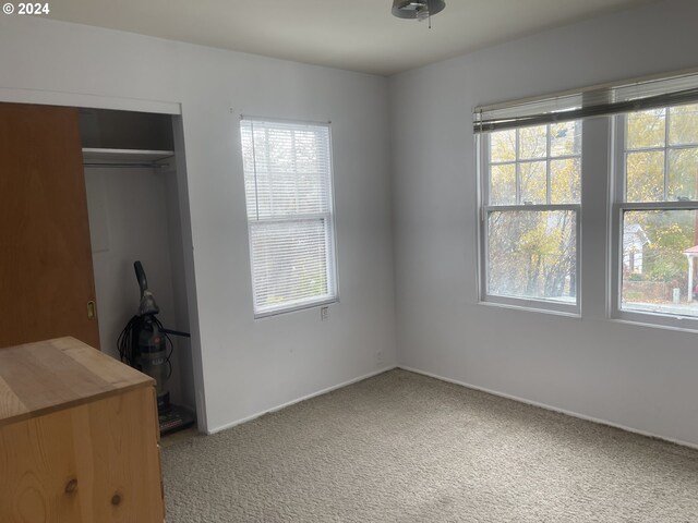 240 N Court St, Heppner, OR 97836 - unfurnished bedroom featuring carpet flooring, multiple windows, a closet, and baseboards