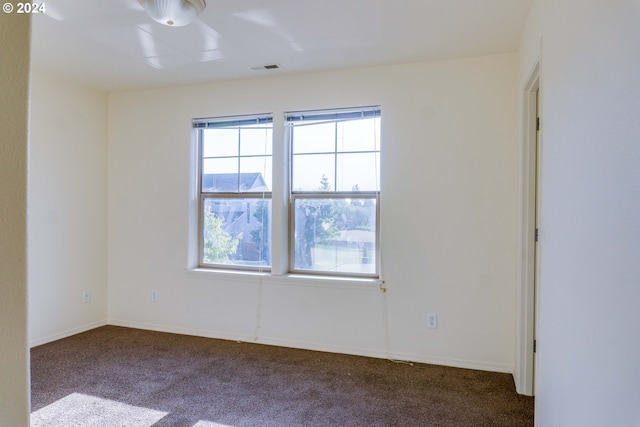 empty room featuring carpet flooring