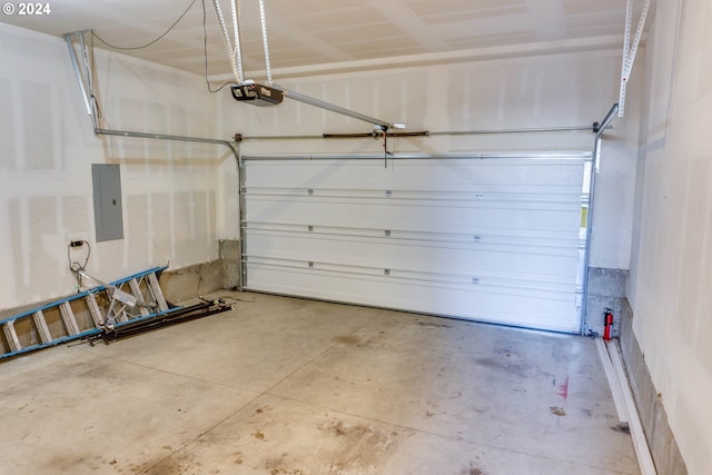 garage featuring a garage door opener and electric panel